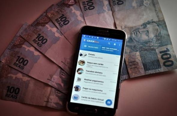 Dinheiro poderá ser movimentado pelo app Caixa Tem — Foto: Saulo Angelo/Futura Press/Estadão Conteúdo - 23.07.2020